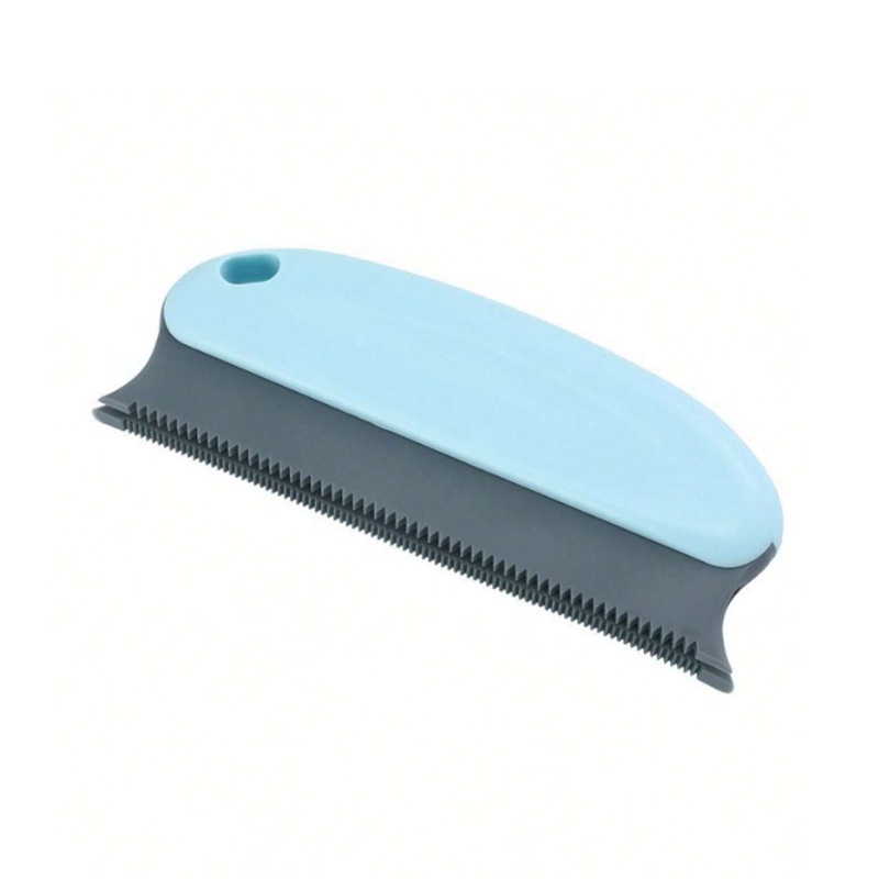 niebieska szczotka do czyszczenia siersci zwierząt z łózka i mebli